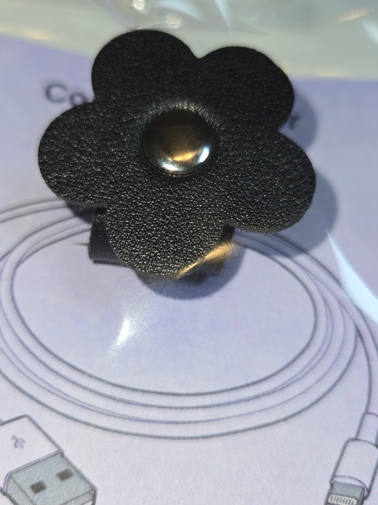 Flower-shaped cord organizer