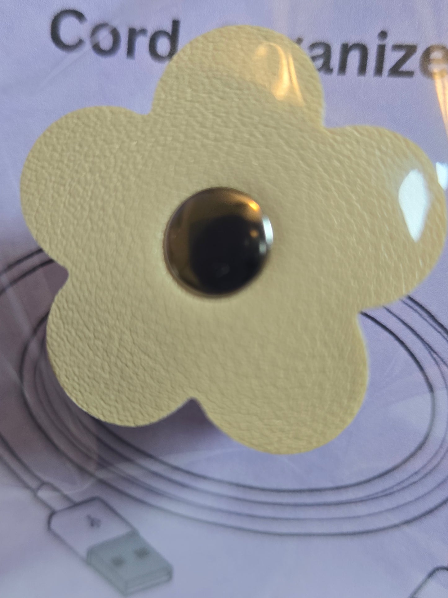 Flower-shaped cord organizer